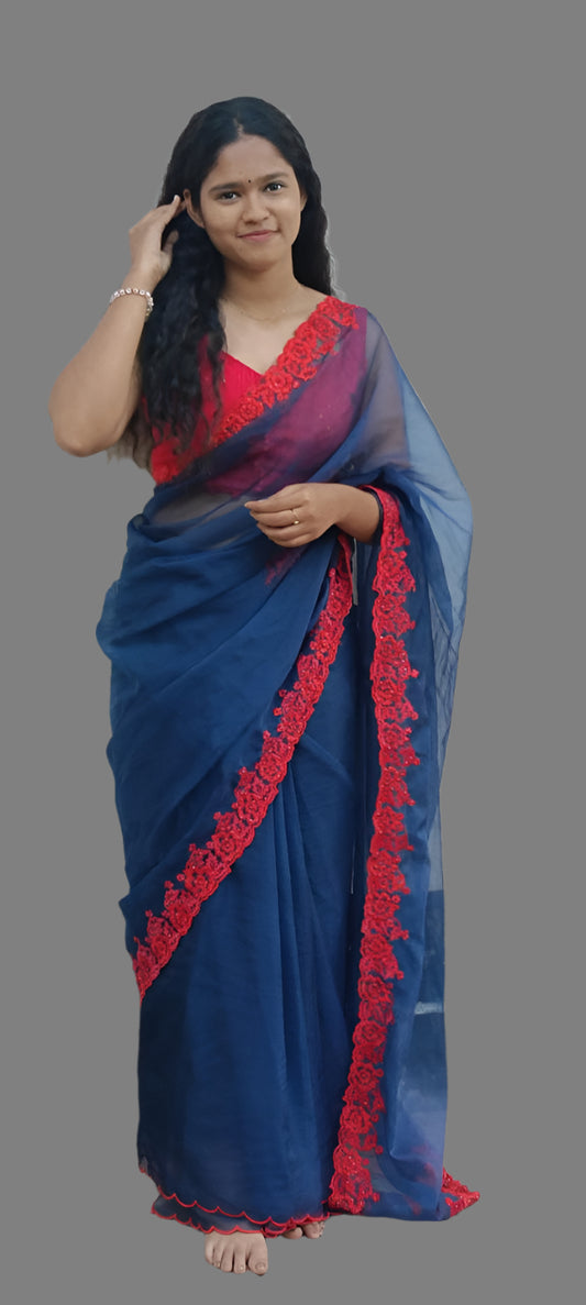 Blue organza saree with red embroidery