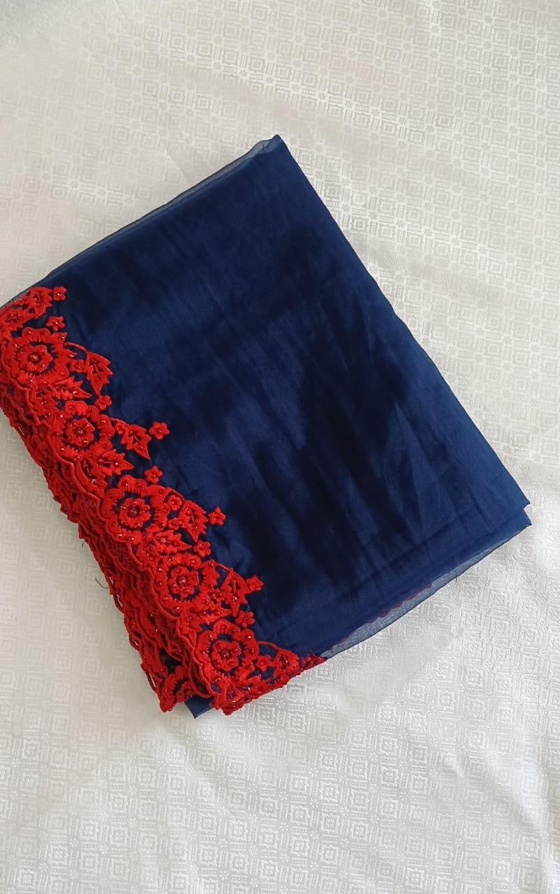 Blue organza saree with red embroidery