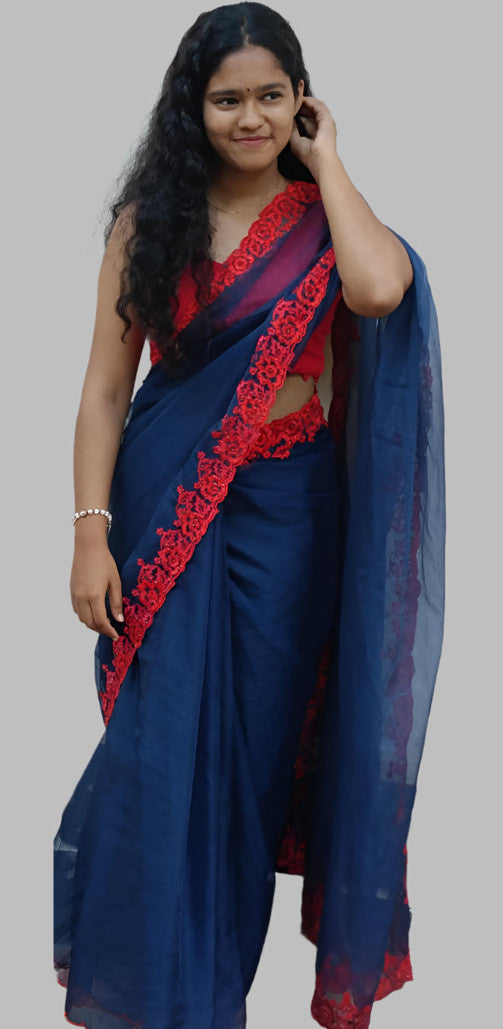 Blue organza saree with red embroidery