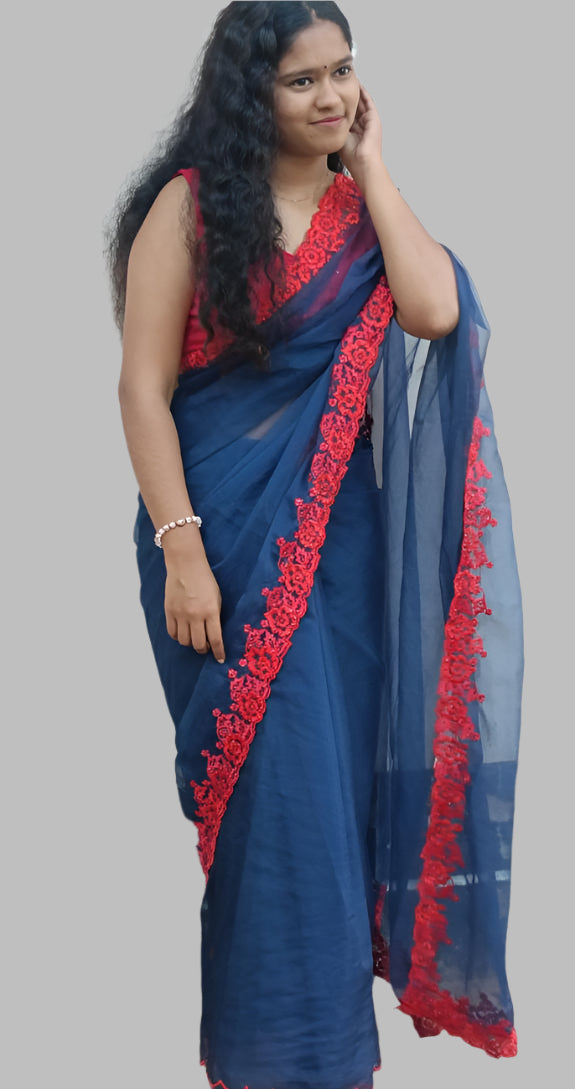 Blue organza saree with red embroidery