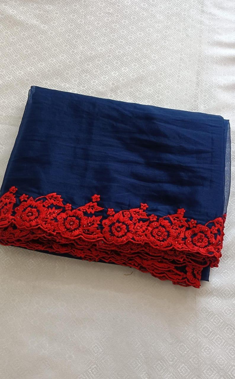 Blue organza saree with red embroidery