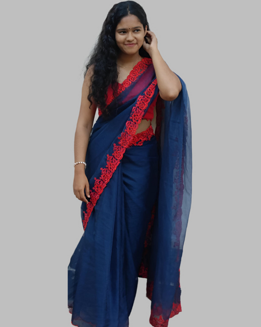 Blue organza saree with red embroidery